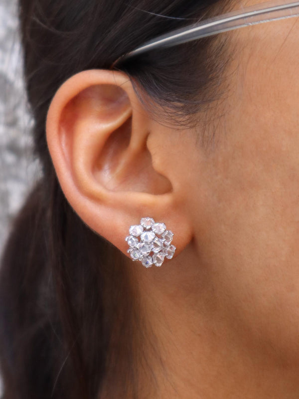 A closeup image of a girl wearing Cubic Crystal Earrings by Live Some India 