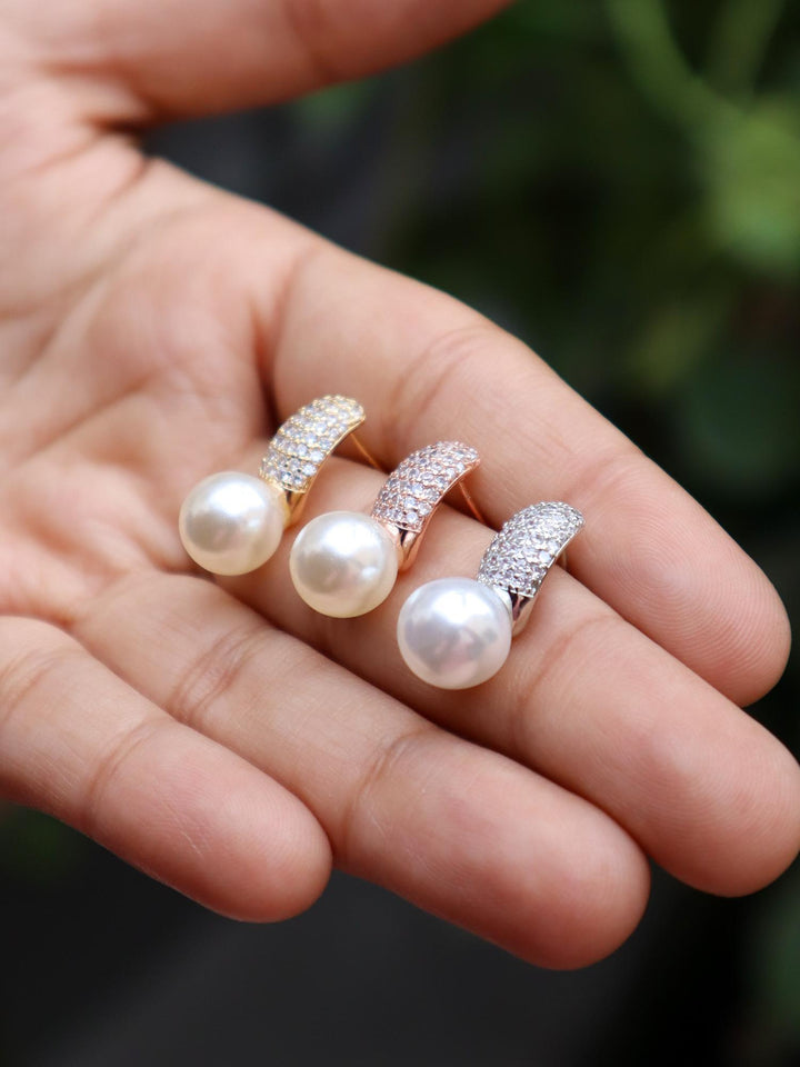 A closeup image of Dainty Pearl Earrings by Live Some India 