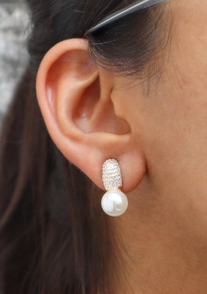 A closeup image of a girl wearing Dainty Pearl Earrings -1 by Live Some India 