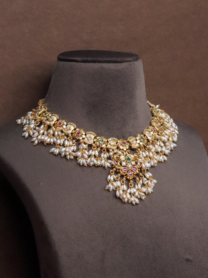 Designer Temple Necklace Set with Pearl Drops by Live Some India on a brown mannequin