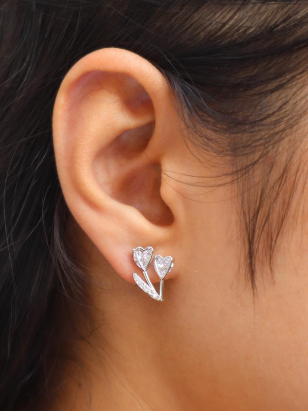 Girl wearing Diamond Heart Flower Earrings by Live Some India