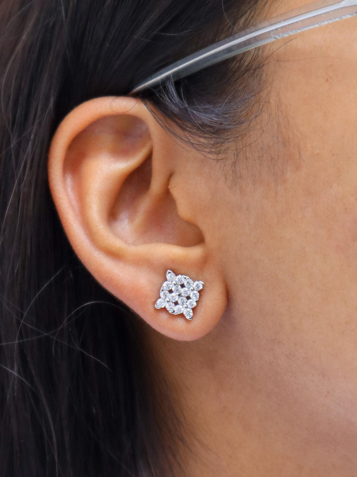 A closeup image of a girl wearing Diamond Statement Earrings  by Live Some India 