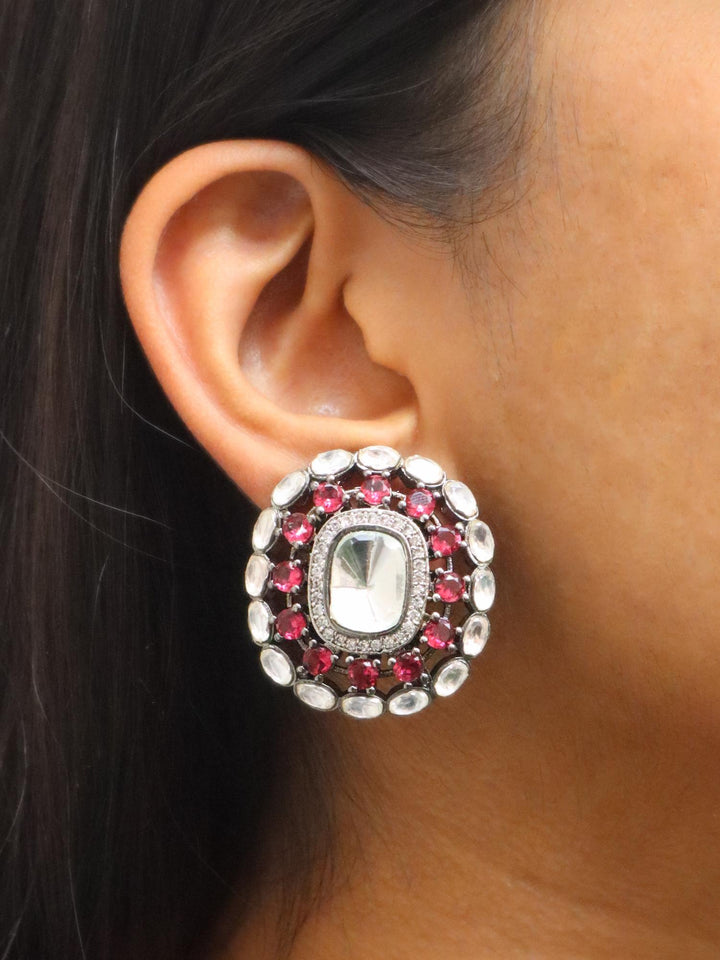 A closeup image of a girl wearing Duality Polki Contemporary Stud Earrings  by Live Some India 