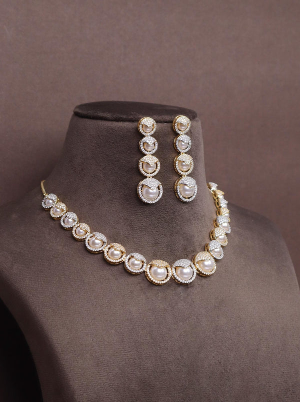 A closeup image of Duo Pearl Necklace Set -4 by Live Some India on a brown dummy 