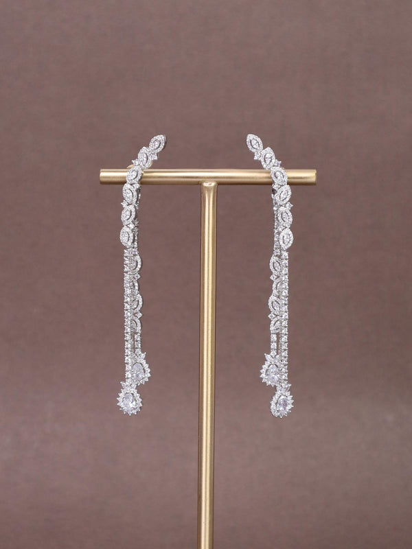 A closeup image of Elated Long Diamond Earrings by Live Some India 