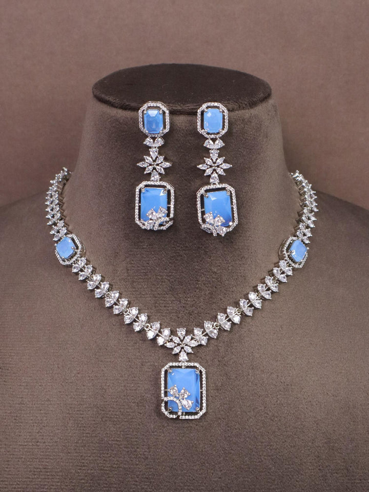 A closeup image of Elegant Blue Diamond Necklace -1 by Live Some India on a brown dummy 