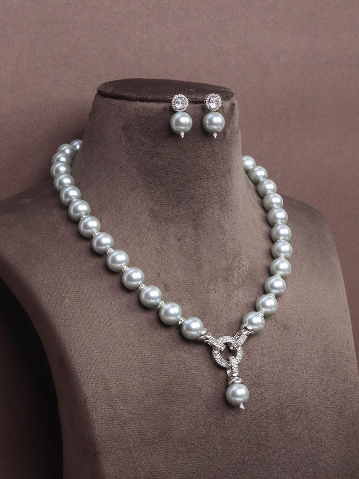  A closeup image of Elegant Three Way Pearl Necklace Set -10 by Live Some India on a brown dummy 