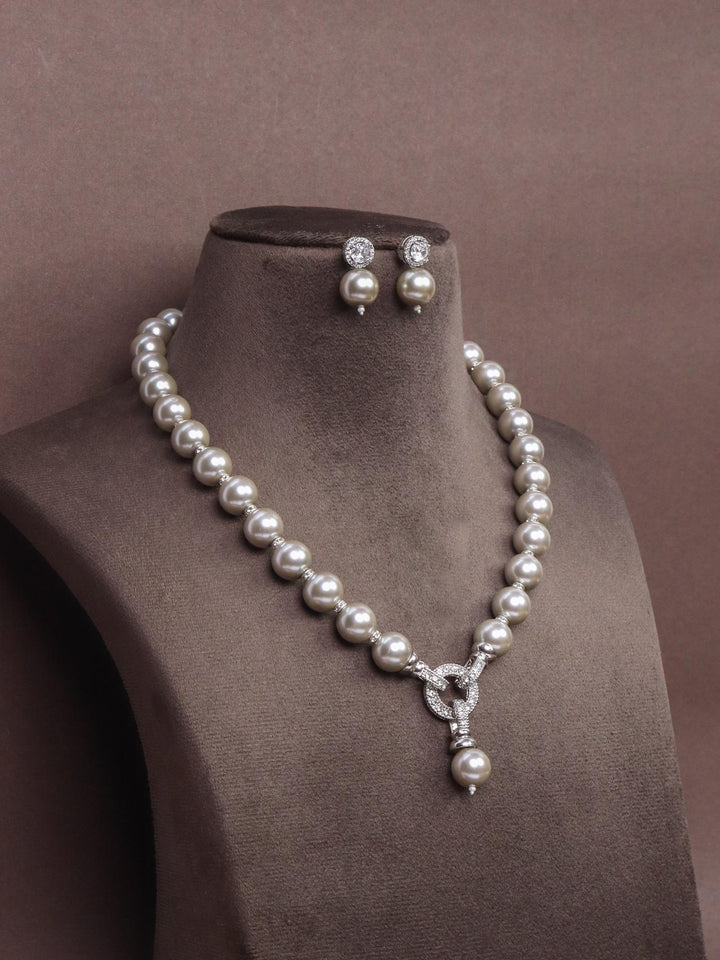 A closeup image of Elegant Three Way Pearl Necklace Set -11 by Live Some India on a brown dummy 