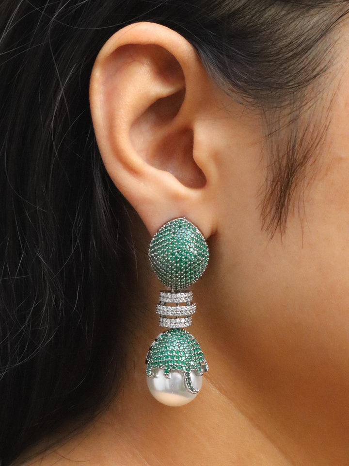 Girl wearing Ella Designer Diamond Dangle Earrings by Live Some India on her right ear