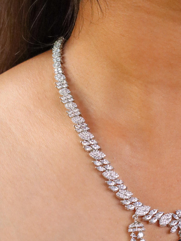 A closeup image of a girl wearing Elongated Sapphire Diamond Necklace 4 by Live Some India 