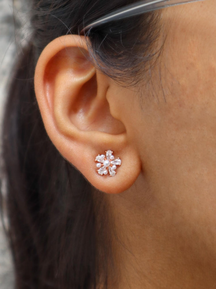 A closeup image of Emerging Pearl Floral Earrings by Live Some India 