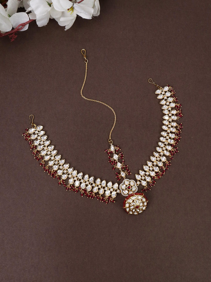 A closeup image of Essence of Royalty Maang Tikka -1 by Live Some India on a brown background 