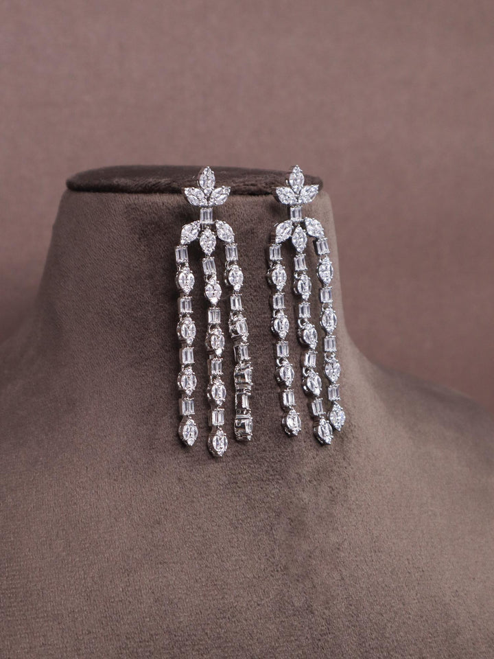 A closeup image of Ethereal Diamond Earrings-1 by Live Some India on a brown dummy 