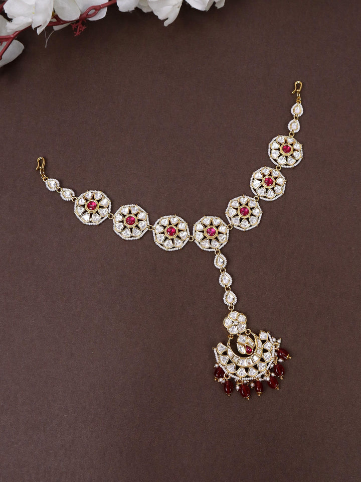 A closeup image of Exquisite Kundan Floral Maang Tikka by Live Some India