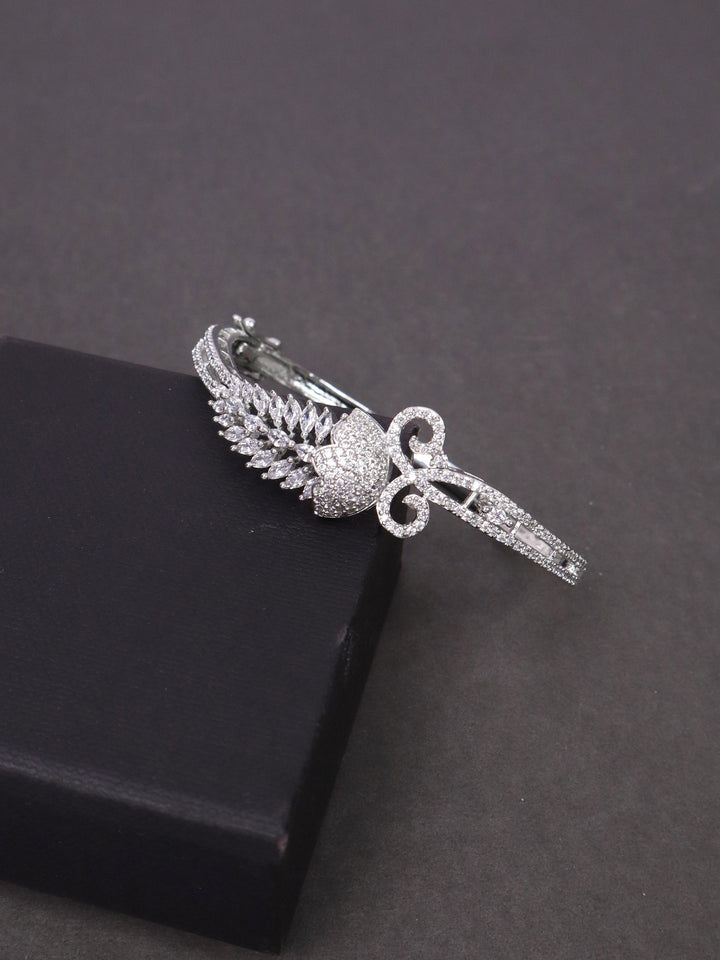 A closeup image of Feather Diamond Bracelet by Live Some India on a black background 