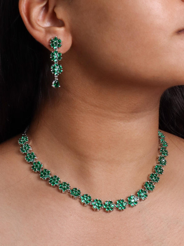 A closeup image of a girl wearing Flora Emerald Diamond Necklace Set -2 by Live Some India 