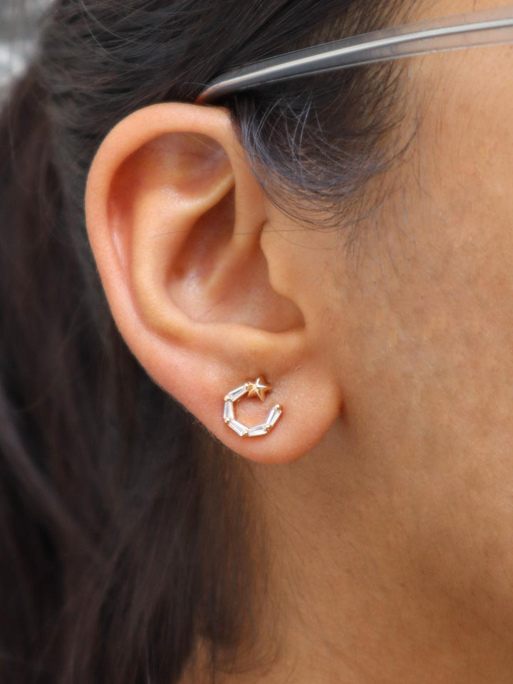 A closeup image of a girl wearing Galaxy Earrings by Live Some India 