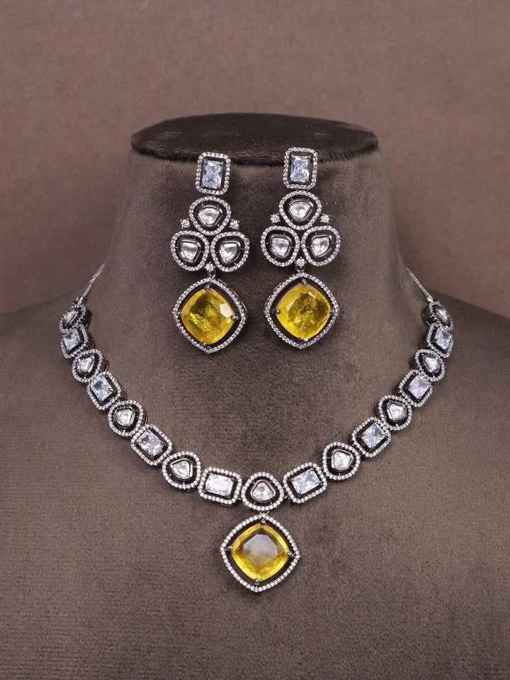 A closeup image of Geometric Diamond Necklace Set -1 by Live Some India on a brown dummy 