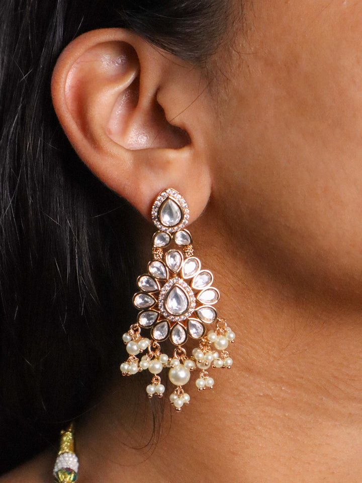 A closeup image of a girl wearing Glory Kundan Polki Earrings -2 by Live Some India 