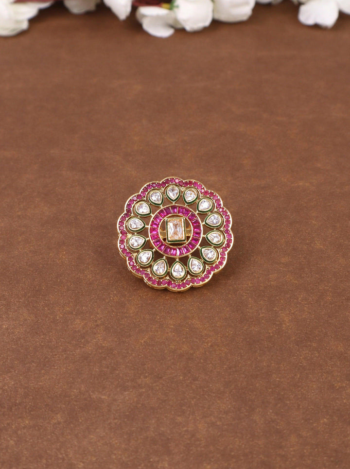 A closeup image of Graceful Kundan Polki Ring -1 by Live Some India on a brown background 