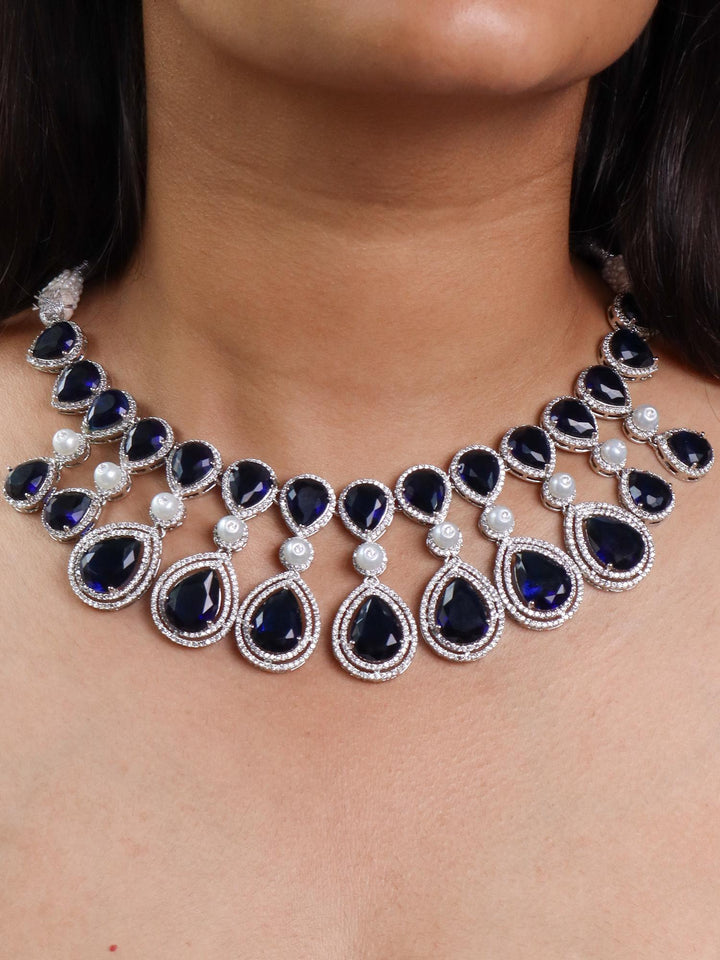 A closeup image of a girl wearing Grand Blue Sapphire Diamond Necklace Set -1 by Live Some India 