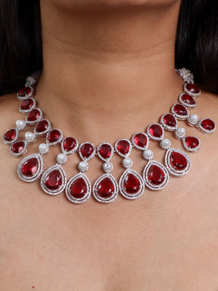 A closeup image of a girl wearing Grand Red Sapphire Diamond Necklace Set by Live Some India