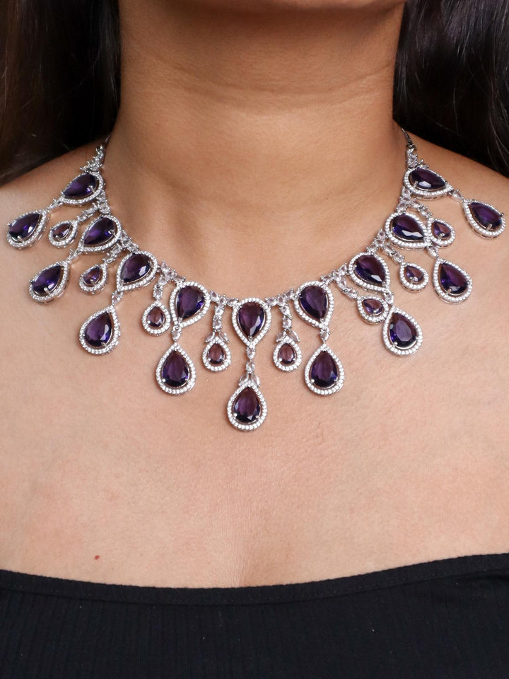 A closeup image of a girl wearing Grand Sapphire Dangler Necklace Set by Live Some India 