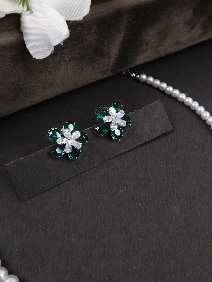 A closeup image of Green Flower Earrings by Live Some India on a black background 