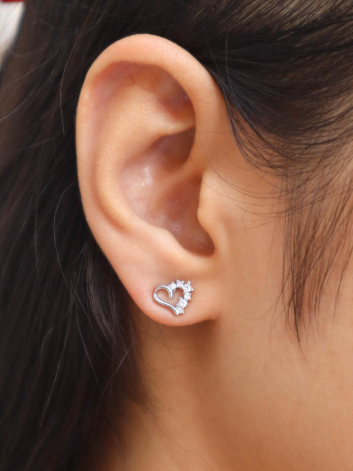 Girl wearing Half Diamond Heart Earrings by Live Some India from 18K Gold Plated Earrings Collection