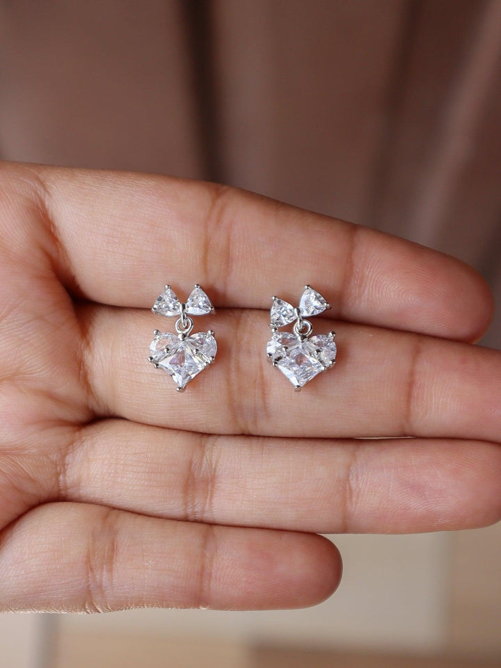 A closeup image of Heart Bow Earrings by Live some India 