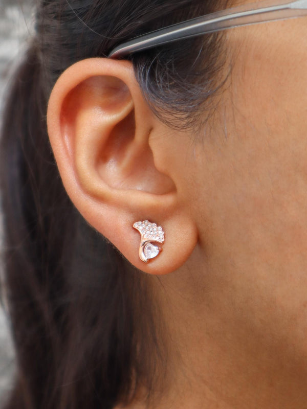 A closeup image of a girl wearing Heart on a Leaf Earrings by Live Some India 