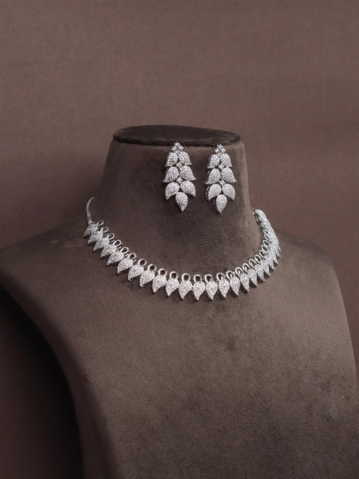 A closeup image o Hooked Diamond Necklace Set by Live Some India on a brown dummy