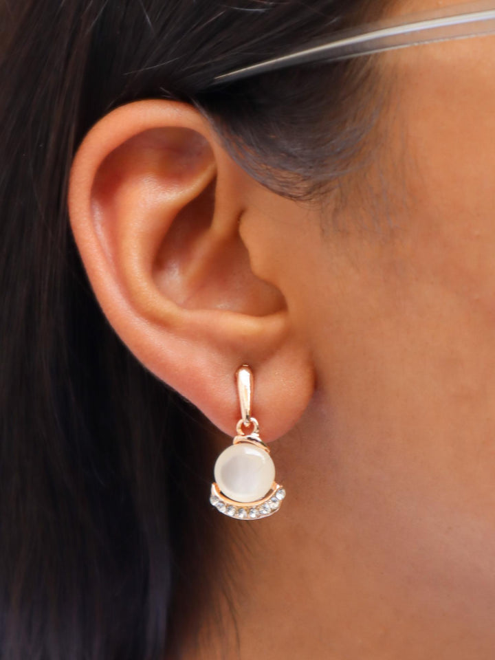 A closeup image of a girl wearing Hugging MOP Earrings by Live Some india 