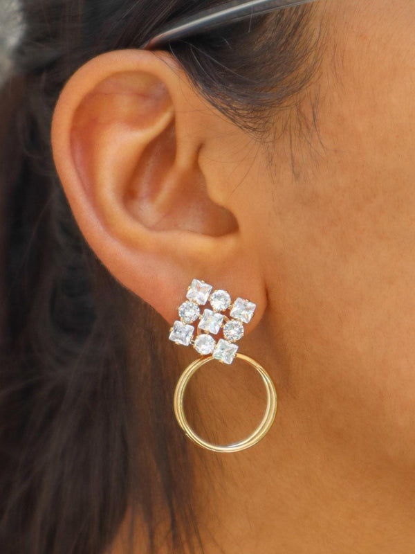 A closeup image of a girl wearing Ice Crystal Drop Earrings by Live Some India 