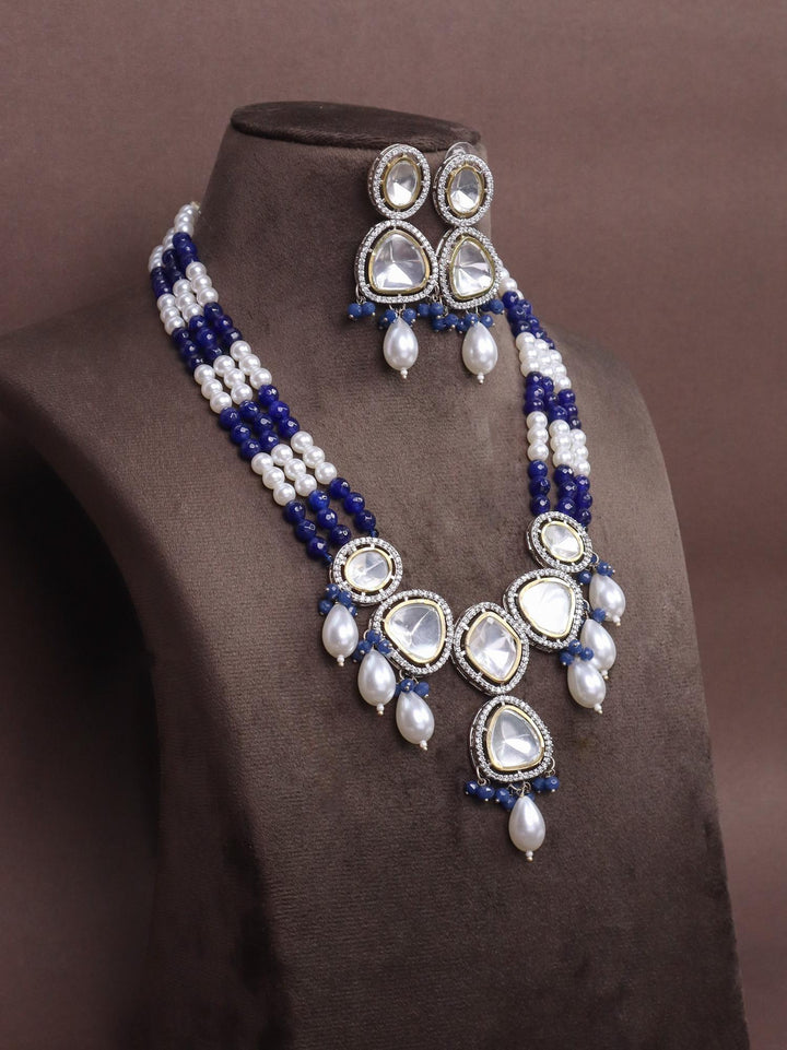 A closeup image of Iya Kundan Polki Necklace Set -3 by Live Some India on a brown dummy 