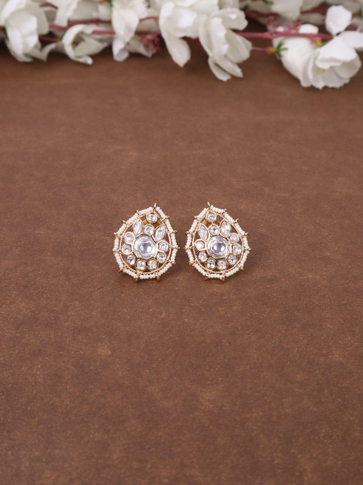 A closeup image of Jaani White Kundan Polki Stud Earrings  by Live Some India 