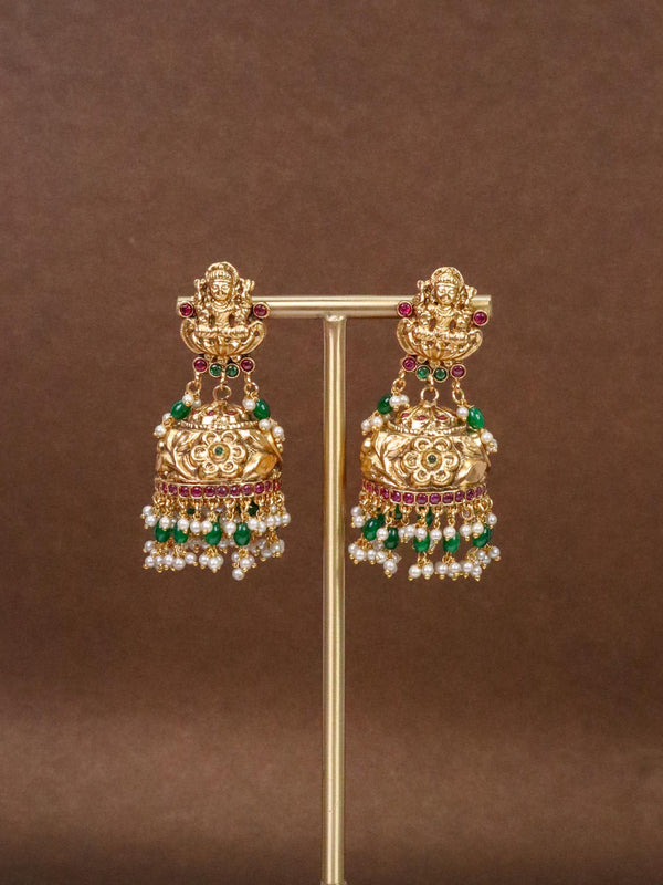 Laxmi Mata Antique Big Jhumka Temple Earrings on an earring stand
