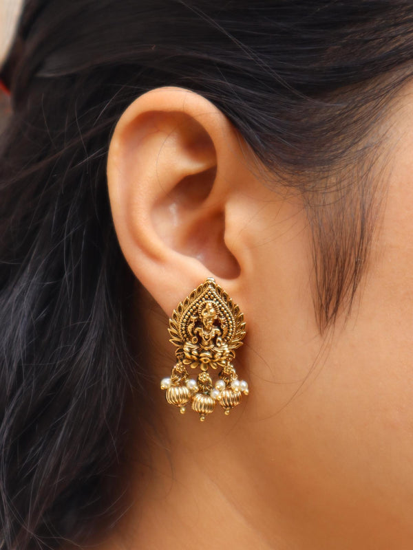 Women wearing Laxmi Mata Stud Earrings by Live Some India