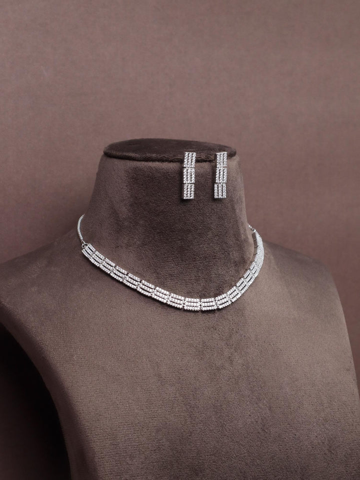 A closeup image of Layered Choker Diamond Necklace Set by Live Some India on a brown dummy 