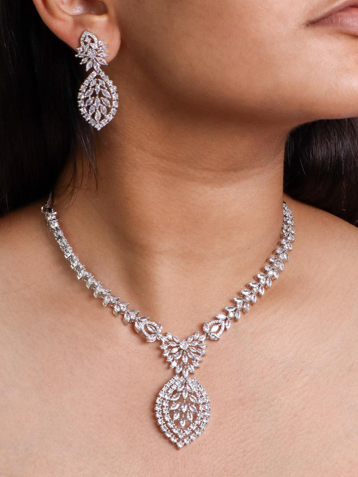 A closeup image of a girl wearing Leaf Studded Diamond Necklace Set -3 by Live Some India 