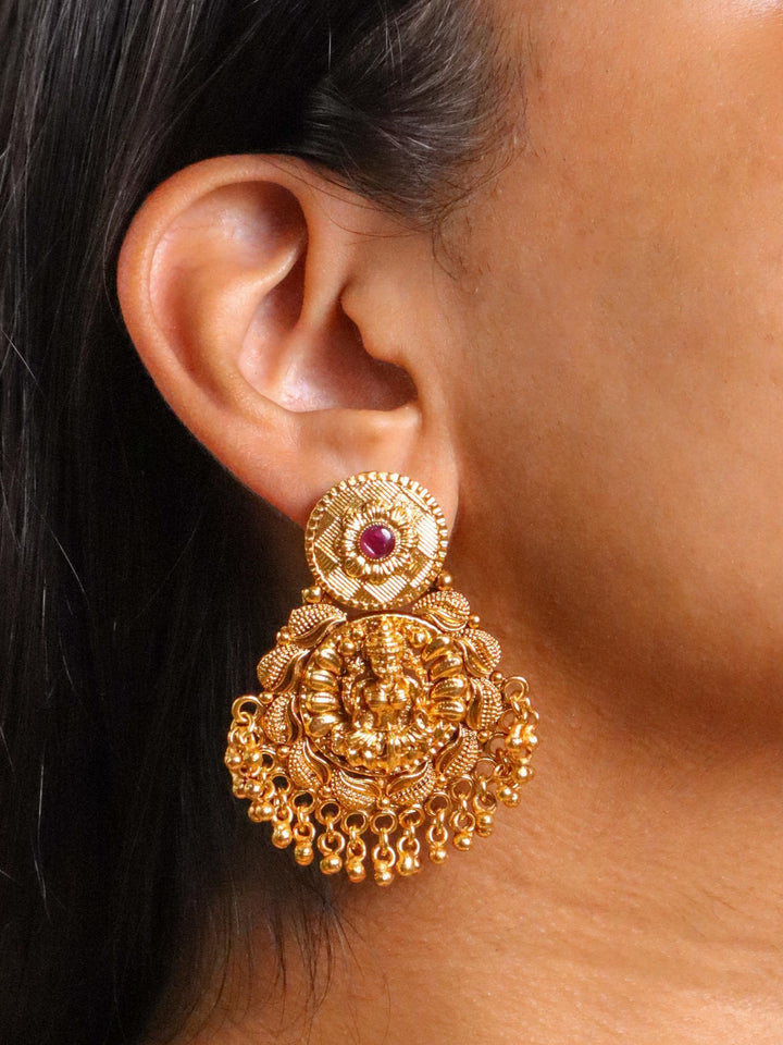 A closeup image of a girl wearing Maa Laxmi Temple Earrings -4 by Live Some India 