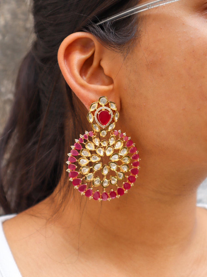 A closeup image of a girl wearing Magenta Chakra Kundan Polki Dangler Earrings by Live Some India 