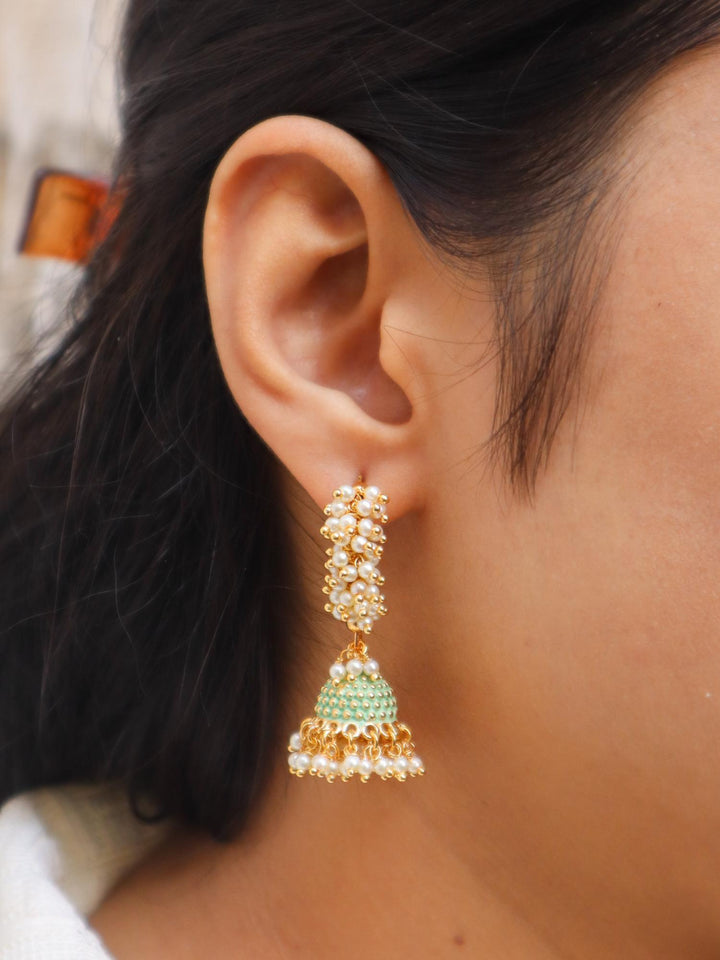 Girl wearing Mahi Pearl Mint Green Jhumka Dangle Earrings by Live Some India