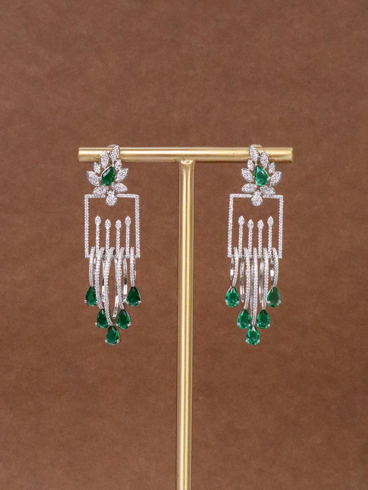 Manvi Designer Diamond Dangle Earrings by Live Some India on an earring stand with brown background