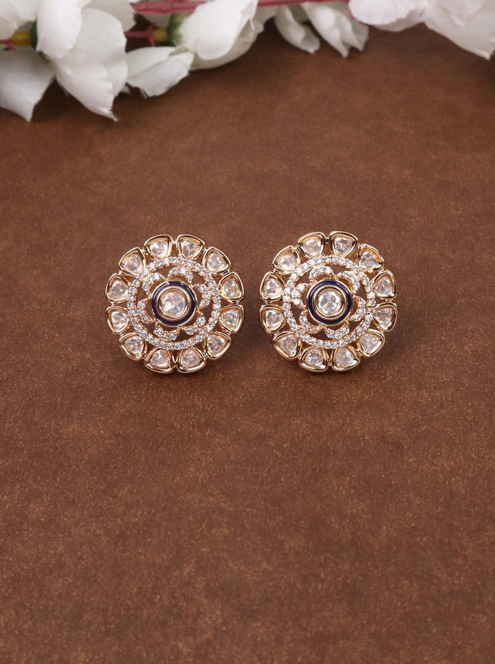 A closeup image of Maryam Maroon Kundan Polki Stud Earrings -1 by Live Some India on a brown background