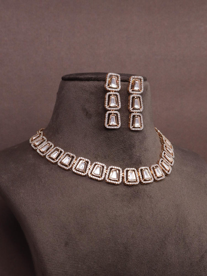 A closeup image of Meera Kundan Polki Necklace Set -3 by Live Some India on a brown dummy 