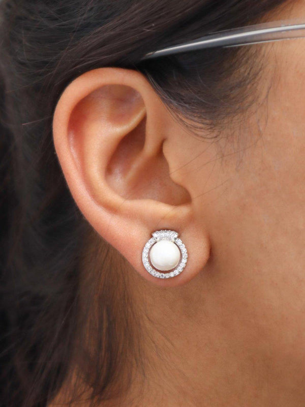 A closeup image of a girl wearing Milky Pearl Earrings by Live Some India 