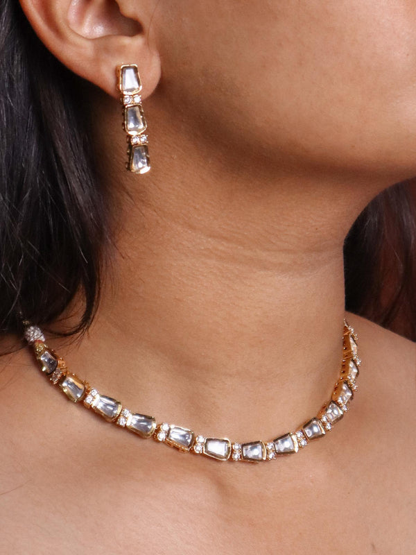 A closeup image of a girl wearing Minimalistic Kundan Polki Necklace Set by Live Some India 