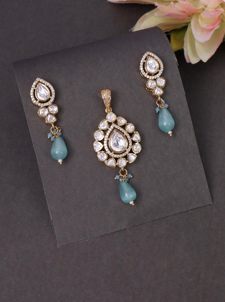 A closeup image of Mint Green Pastel Pearl Drop Pendant Set by Live Some India on a black bakcground 