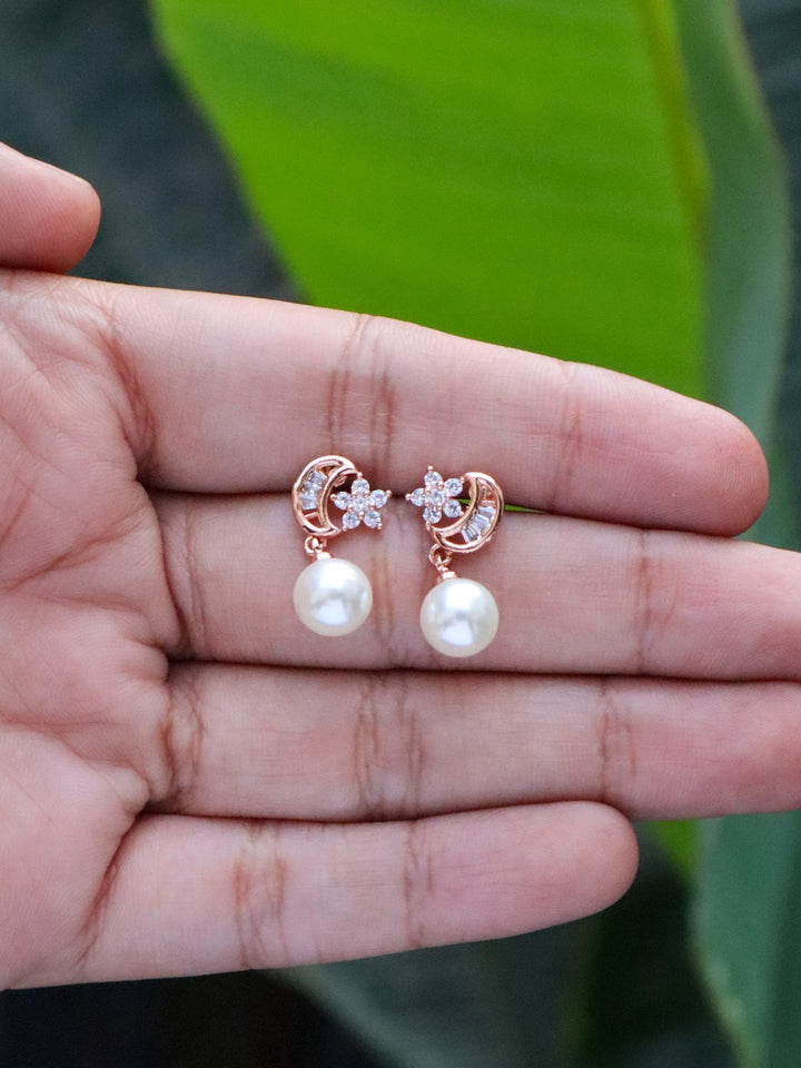 Moon & Star with Pearls Dangle Earrings by Live Some India on hands